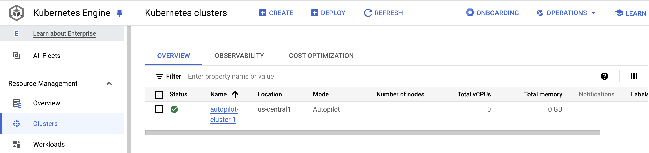 Kubernetes Clusters page displaying details such as location, cluster size, total cores, and total memory for autopilot-cluster-1