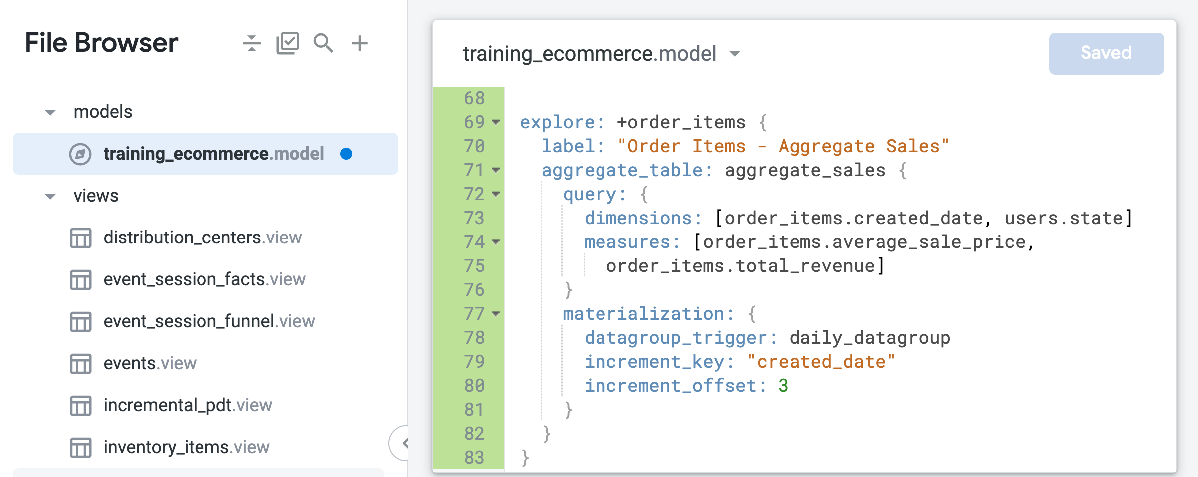 The open training_ecommerce.model file displaying the order items explore refinement lookml code