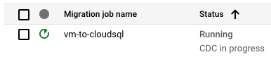 The migration job named vm-to-cloudsql has a status of running CDC in progress.